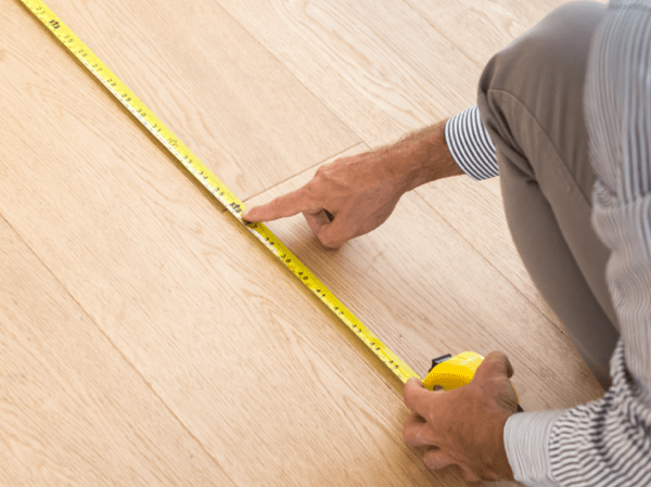 Man measuring floor | National Design Mart | Northeast Ohio