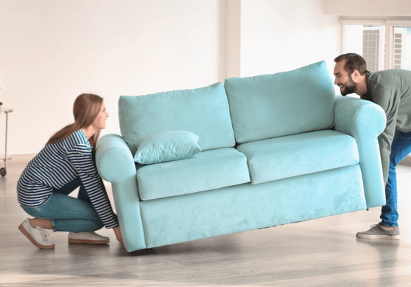 Couple moving sofa | National Design Mart | Northeast Ohio